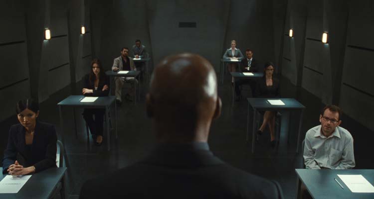 Exam 2009 Movie Scene Colin Salmon as The Invigilator giving instructions to the eight candidates in the room