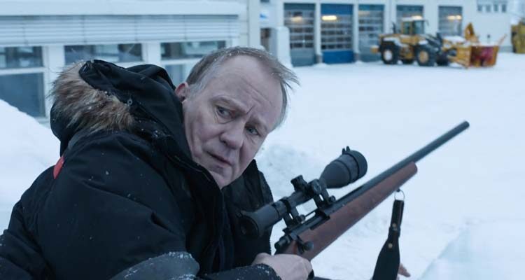 Kraftidioten AKA In Order of Disappearance 2014 Movie Scene Stellan Skarsgård as Nils Dickman holding a sniper rifle and waiting for his enemies to come