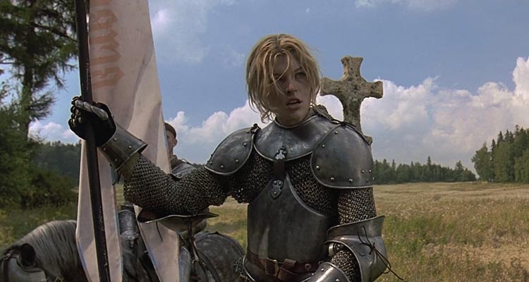 The Messenger The Story of Joan of Arc 1999 Movie Milla Jovovich as Joan of Arc riding a horse in full armor and holding her banner