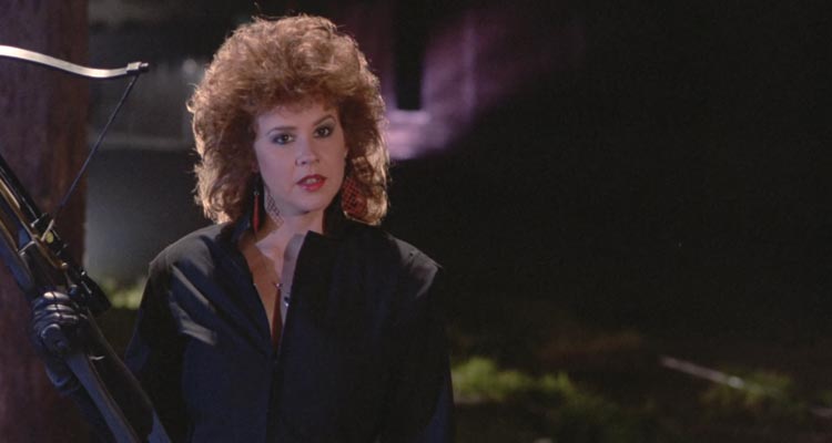 Savage Streets 1984 Movie Scene Linda Blair as Brenda holding a crossbow and exacting revenge