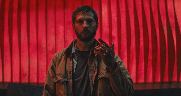 Upgrade 2018 Movie Scene Logan Marshall-Green as Grey Trace STEM tasting human blood after becoming self-aware during the finale