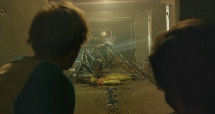 It Came From The Desert 2017 Movie Scene Harry Lister Smith as Brian and Alex Mills as Lukas seeing a giant ant eating a scientist in an underground bunker