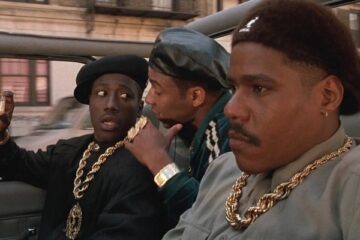 New Jack City 1991 Movie Scene Wesley Snipes as Nino Brown holding a bottle of crack cocaine and talking to Allen Payne as Gee Money and Bill Nunn as Duh Duh Duh Man