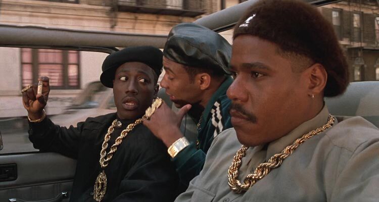 New Jack City 1991 Movie Scene Wesley Snipes as Nino Brown holding a bottle of crack cocaine and talking to Allen Payne as Gee Money and Bill Nunn as Duh Duh Duh Man