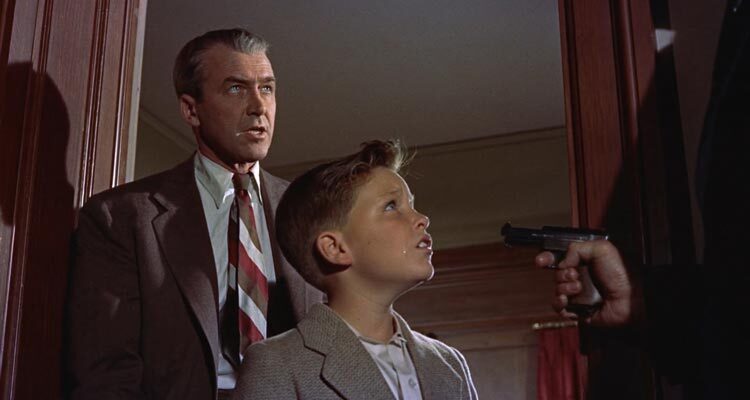 The Man Who Knew Too Much 1956 Movie Scene James Stewart as Dr. Benjamin McKenna and Christopher Olsen as Hank kidnapped at gunpoint