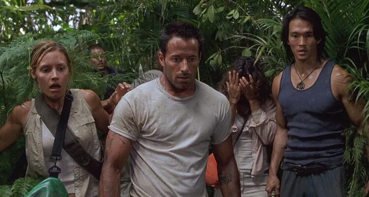 Anacondas The Hunt for the Blood Orchid 2004 Movie Scene Johnny Messner as Bill, KaDee Strickland as Sam and Karl Yune as Tran in the jungle looking at a giant snake