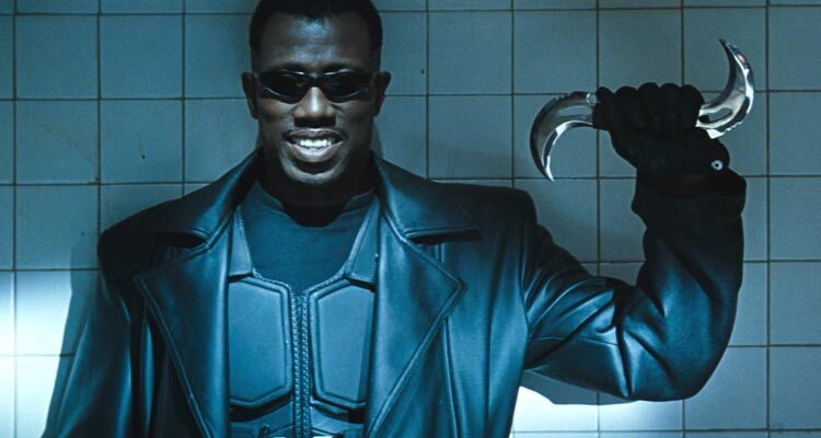 Blade 1998 Movie Scene Wesley Snipes as Blade in a leather suit wearing sunglasses and holding a special boomerang weapon