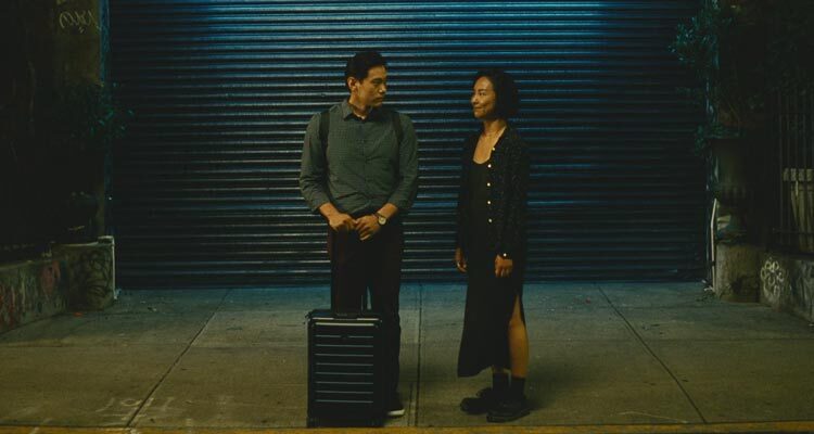 Past Lives 2023 Movie Scene Greta Lee as Nora/Na Young and Teo Yoo as Hae Sung saying goodbye as he flies back to South Korea