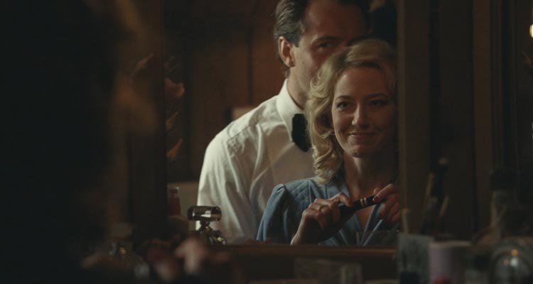 The Nest 2020 Movie Scene Carrie Coon as Allison putting makeup on while Jude Law as Rory is seducing her