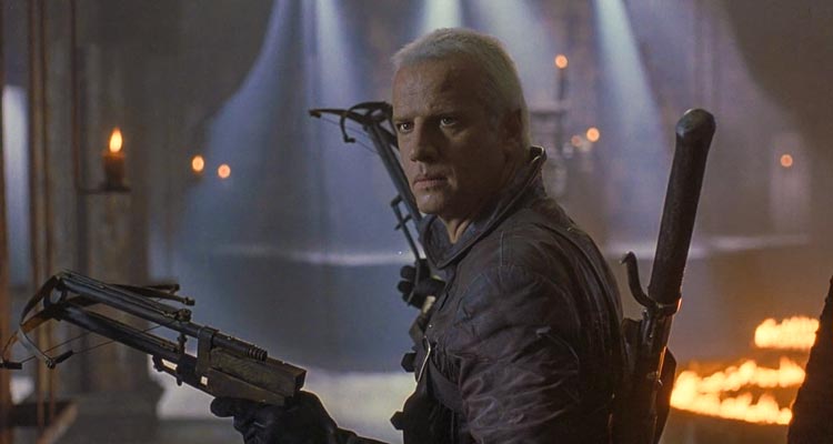 Beowulf 1999 Movie Scene Christopher Lambert as Beowulf holding double crossbows and looking for Grendel, the beast