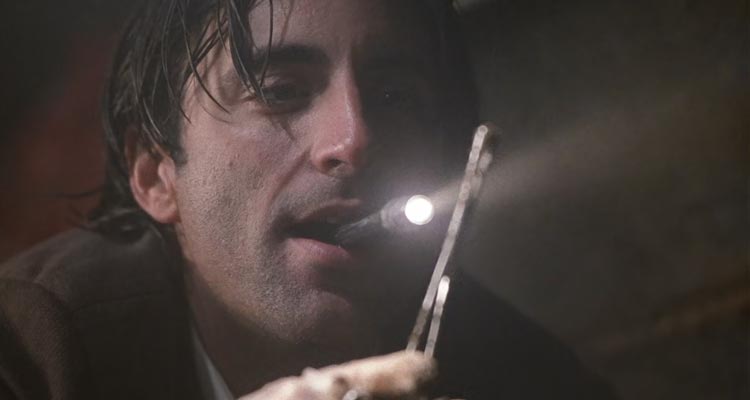 Jennifer Eight 1992 Movie Scene Andy Garcia as John Berlin finding a bullet at the dump