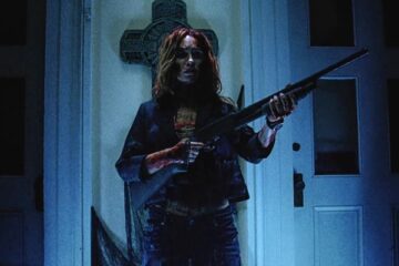 Night of the Demons 2009 Movie Scene Monica Keena as Maddie all bloody holding a shotgun
