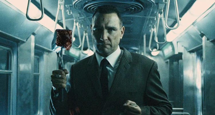 The Midnight Meat Train 2008 Movie Scene Vinnie Jones as Mahogany holding a bloody butchers hammer in the train