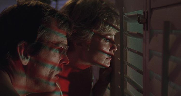 Cape Fear 1991 Movie Scene Nick Nolte as Sam Bowden and Jessica Lange as Leigh watching through the shutters of their window at Max Cady