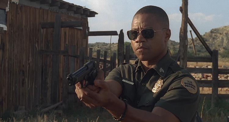 Linewatch 2008 Movie Scene Cuba Gooding Jr. as Michael Dixon in his border patrol uniform holding a gun pointed at the criminals