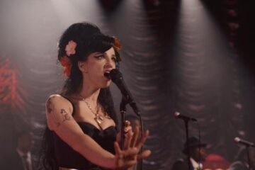 Back to Black 2024 Movie Scene Marisa Abela as Amy Winehouse singing on stage