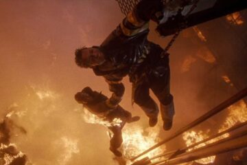 Backdraft 1991 Movie Scene Kurt Russell as Stephen McCaffrey holding Scott Glenn as John Adcox above the fiery pit