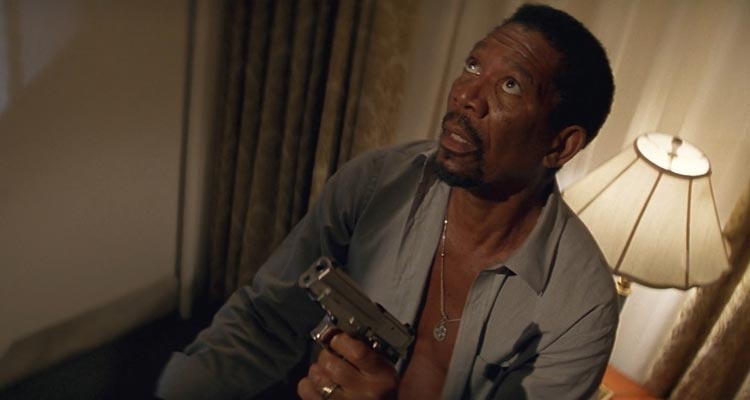Kiss The Girls 1997 Movie Scene Morgan Freeman as Dr. Alex Cross holding a gun and chasing a serial killer in his hotel