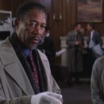 Along Came a Spider 2001 Movie Scene Morgan Freeman as Alex Cross on the crime scene pointing at something with Monica Potter as Jezzie standing in the background