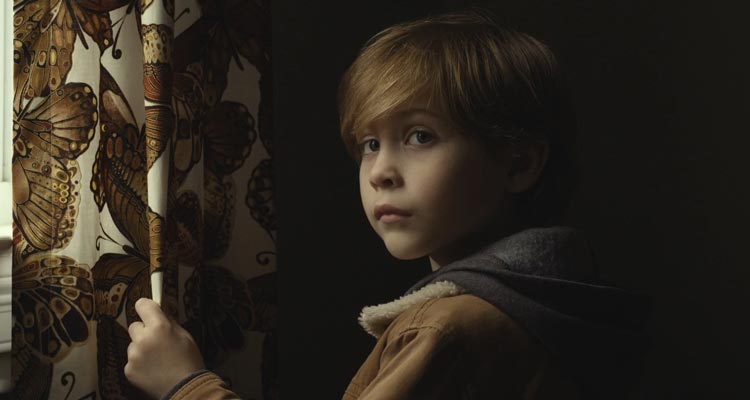 Before I Wake 2016 Movie Scene Jacob Tremblay as Cody standing next to a curtain because it has butterflies