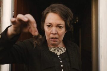 Wicked Little Letters 2023 Movie Scene Olivia Colman as Edith Swan looking at the clump of hair in disgust