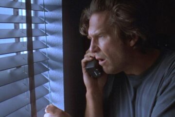 Arlington Road 1999 Movie Scene Jeff Bridges as Michael Faraday watching through the window his new neighbors who he thinks are terrorists