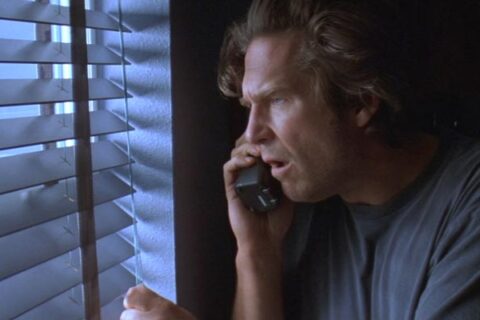 Arlington Road 1999 Movie Scene Jeff Bridges as Michael Faraday watching through the window his new neighbors who he thinks are terrorists