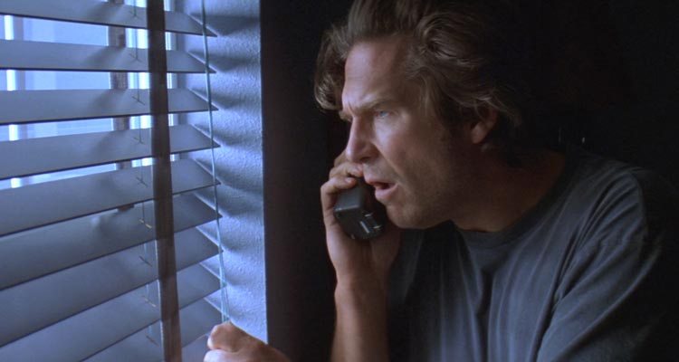 Arlington Road 1999 Movie Scene Jeff Bridges as Michael Faraday watching through the window his new neighbors who he thinks are terrorists