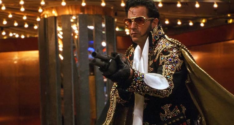 3000 Miles To Graceland 2001 Movie Scene Kevin Costner as Murphy wearing an Elvis costume and holding a shotgun during a casino heist