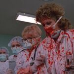 Blue Monkey 1987 Movie Scene Doctors covered in blood after a patient explodes in front of them