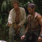 Gunmen 1993 Movie Scene Christopher Lambert as Dani Servigo and Mario Van Peebles as Cole Parker in the jungle running away from the bad guys