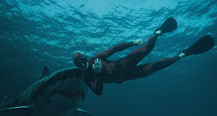 The Last Breath 2024 Movie Scene A big great white shark about to bite Julian Sands as Levi in his red diving suit at the end of the movie