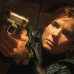 Murder By Numbers 2002 Movie Scene Sandra Bullock as Cassie holding a gun
