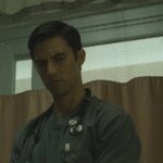 Pathology 2008 Movie Scene Milo Ventimiglia as Ted Grey wearing a stethoscope and about to kill his patient