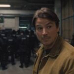 Trap 2024 Movie Scene Josh Hartnett as Cooper surprised at the presence of police at the concert of Lady Raven