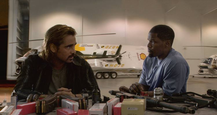 Miami Vice 2006 Movie Scene Colin Farrell as Sonny and Jamie Foxx as Rico in their secret hideout in front of a table full of weapons and ammo