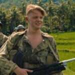 The East AKA De Oost 2020 Movie Scene Jonas Smulders as Mattias Cohen holding a Bren Mk1 heavy machinegun while on patrol in Indonesia