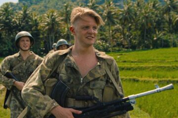 The East AKA De Oost 2020 Movie Scene Jonas Smulders as Mattias Cohen holding a Bren Mk1 heavy machinegun while on patrol in Indonesia