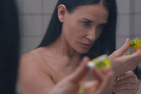 The Substance 2024 Movie Scene Demi Moore as Elisabeth preparing the inject the drug in her bathroom