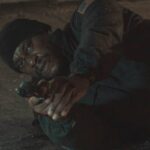 1992 Movie 2022 Scene Tyrese Gibson as Mercer Bey holding a gun