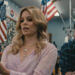 Skincare 2024 Movie Scene Elizabeth Banks as Hope holding a gun in a gun store