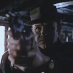 The French Connection 1971 Movie Scene Gene Hackman as Jimmy Popeye Doyle holding his gun during the final fight