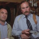 The Long Good Friday 1980 Movie Scene Bob Hoskins as Harold and P.H. Moriarty as Razors holding a huge knife