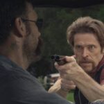 Bad Country 2014 Movie Scene Willem Dafoe as Bud Carter holding a double barrel shotgun pointed at Matt Dillon as Jesse Weiland