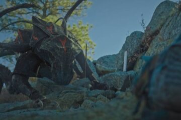 Elevation 2024 Movie Scene The Reaper monster hunting Anthony Mackie as Will on top of the mountain