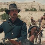 Hostiles 2017 Movie Scene Christian Bale as Joe Blocker holding a gun and stopping his party