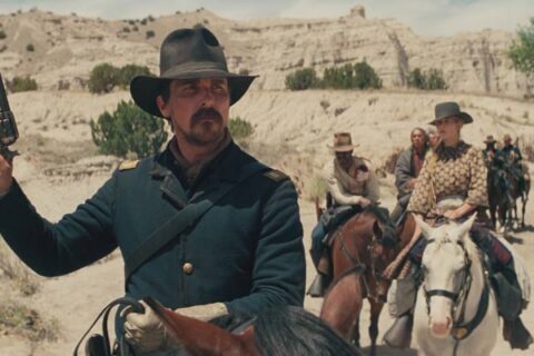 Hostiles 2017 Movie Scene Christian Bale as Joe Blocker holding a gun and stopping his party