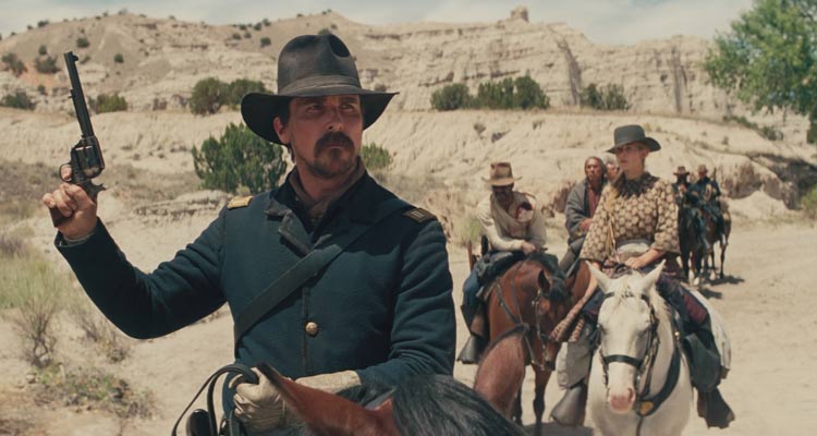 Hostiles 2017 Movie Scene Christian Bale as Joe Blocker holding a gun and stopping his party