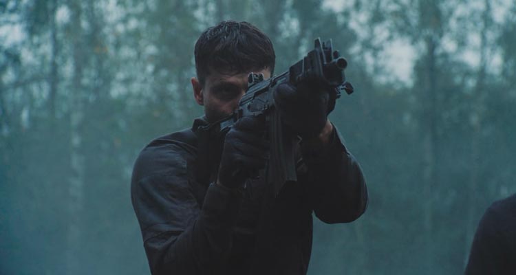 Running With Tigers AKA Tigres Et Hyenes 2024 Movie Scene Waël Sersoub as Malik practicing shooting in the woods before the heist
