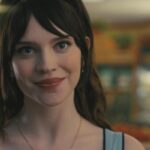 Companion 2025 Movie Scene Sophie Thatcher as Iris in the supermarket falling in love with Josh